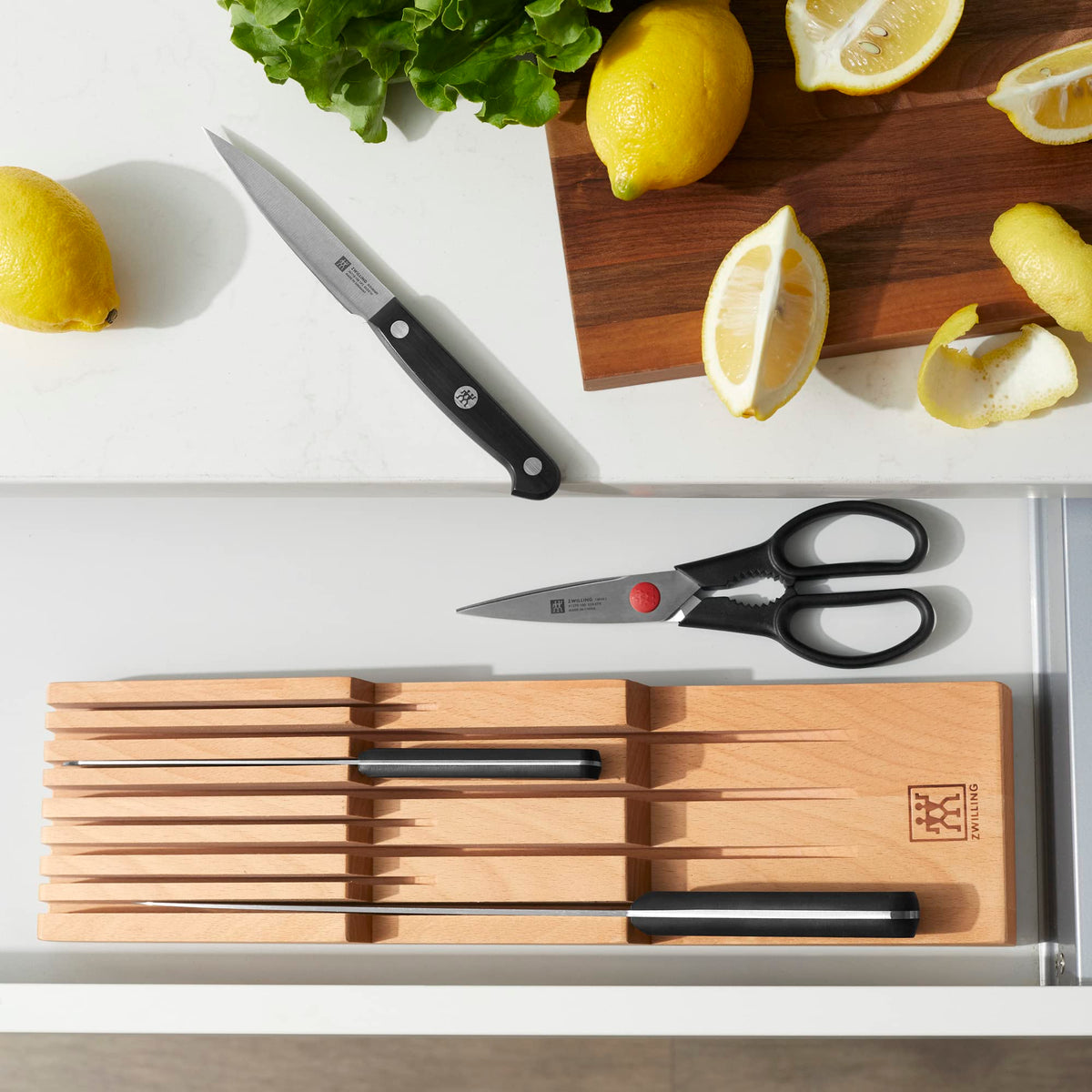 ZWILLING beechwood in-drawer organizer keeps knives protected and clutter-free.