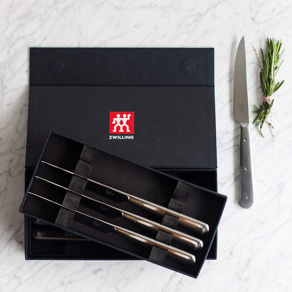 ZWILLING ergonomic stainless-handle design for comfortable slicing.