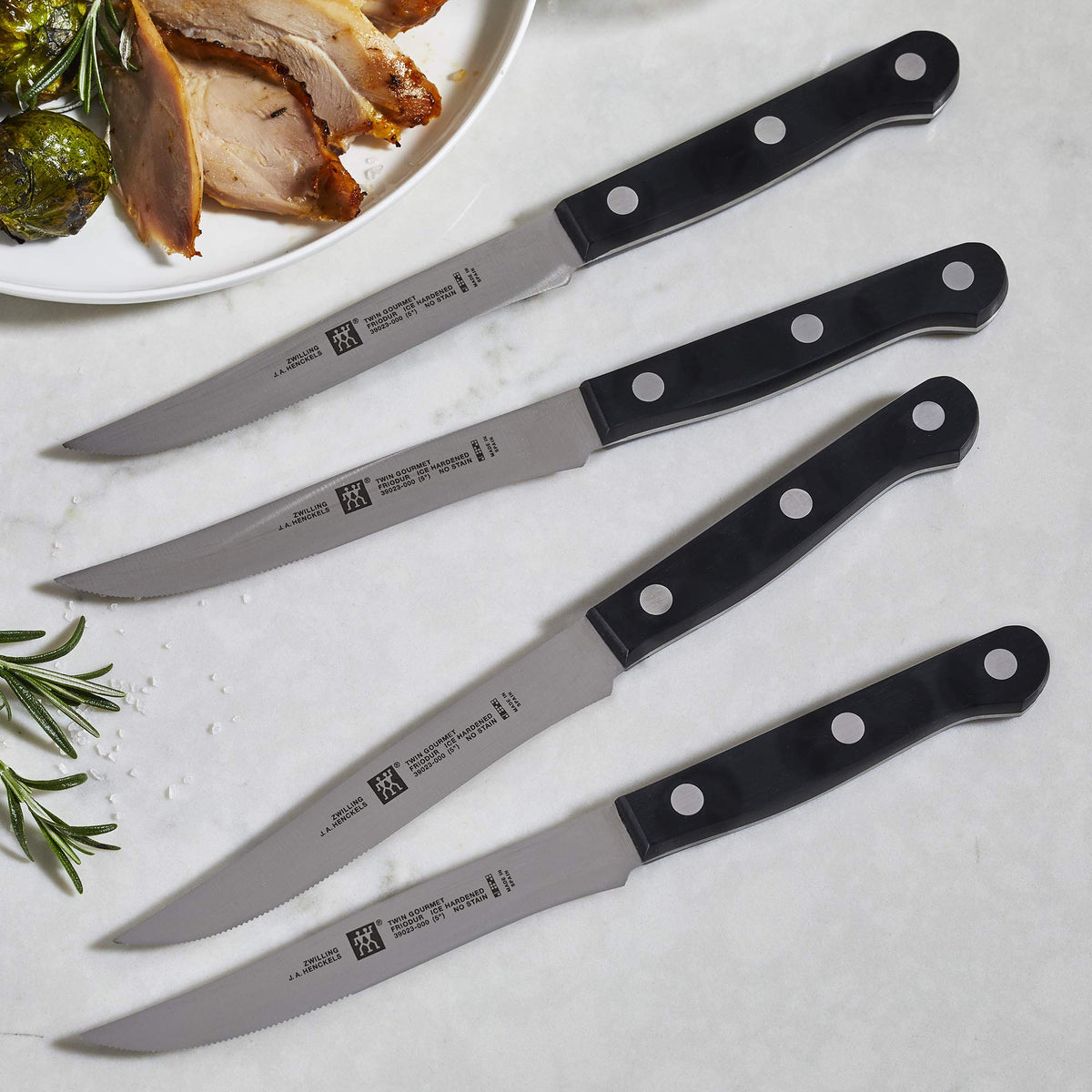 ZWILLING Twin Gourmet steel blades close-up showing sharp, durable cutting edge.