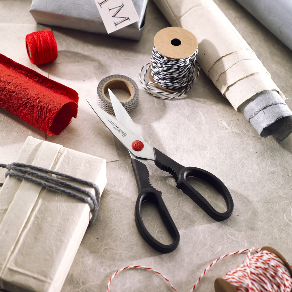 ZWILLING Twin L kitchen shears ergonomic handle in hand for comfortable control.