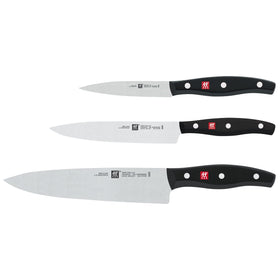 ZWILLING Twin Signature one-piece stamped blade highlighting lightweight strength.