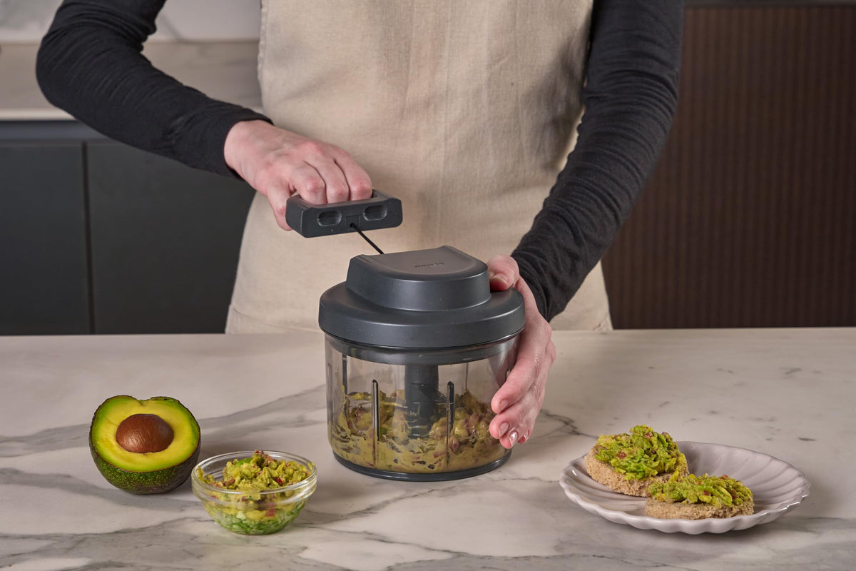 Zyliss Easy Pull food holder protects hands during slicing for safer prep.