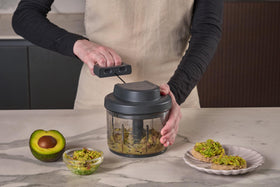 Zyliss Easy Pull food holder protects hands during slicing for safer prep.